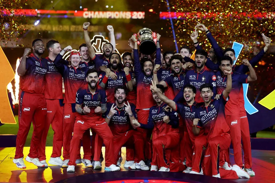 Cricket - Indian Premier League - IPL - Final - Royal Challengers Bengaluru v Gujarat Titans - Narendra Modi Stadium, Ahmedabad, India - May 31, 2026 Royal Challengers Bengaluru's Rajat Patidar lifts the trophy as he celebrates with teammates after winning the Indian Premier League REUTERS/Amit Dave
