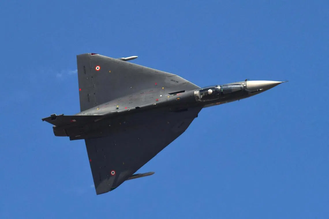FILE PHOTO: Indian Air Force (IAF) LCA Tejas performs an aerobatic display during the Aero India 2023 air show at Yelahanka air base in Bengaluru, India, February 13, 2023. REUTERS/Samuel Rajkumar/File Photo
