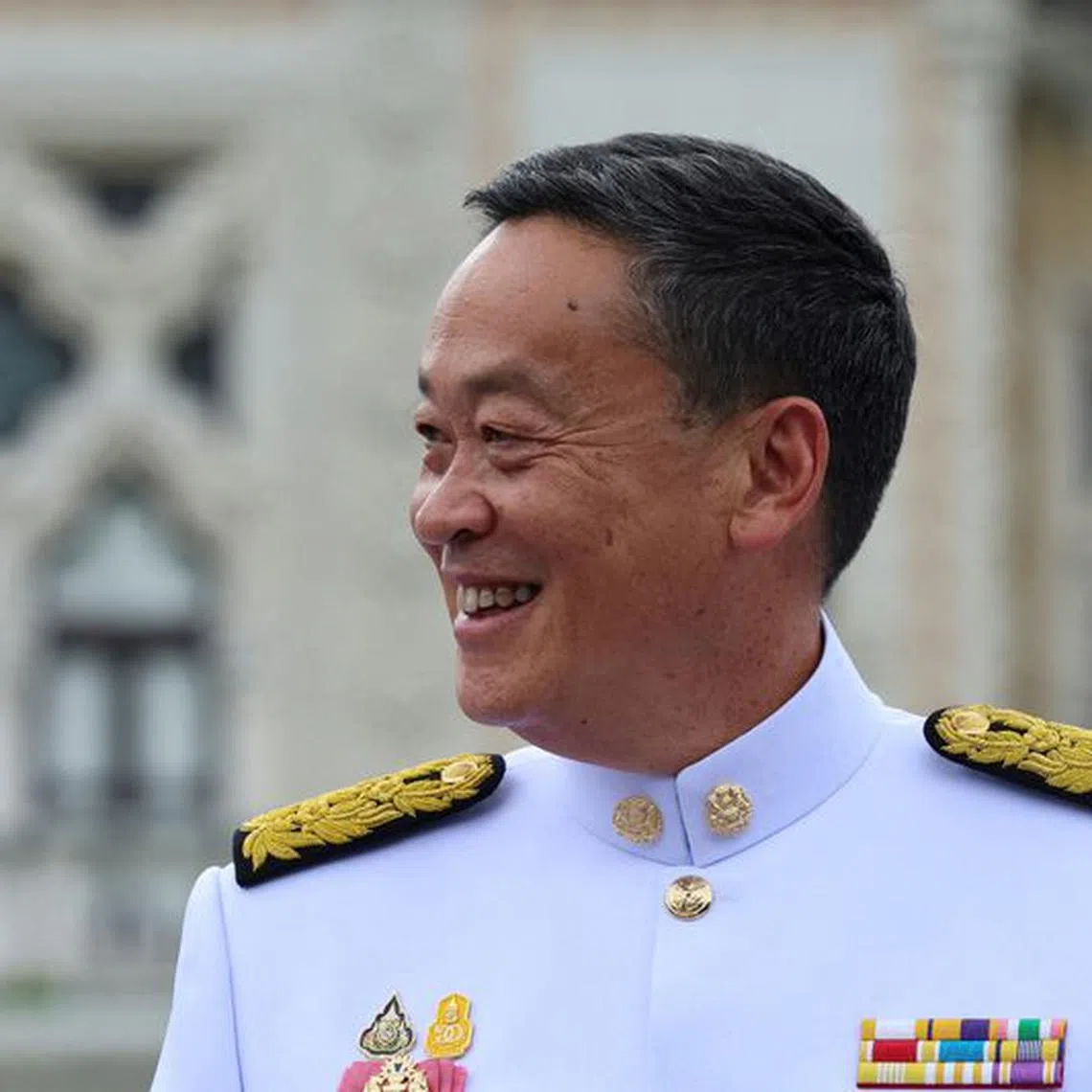 Thailand's Prime Minister Srettha Thavisin reacts as he poses for a group photo with his cabinet members (not pictured) at the government house after a royal audience ceremony to swear the oath of allegiance in Bangkok, Thailand, September 5, 2023. REUTERS/Athit Perawongmetha
