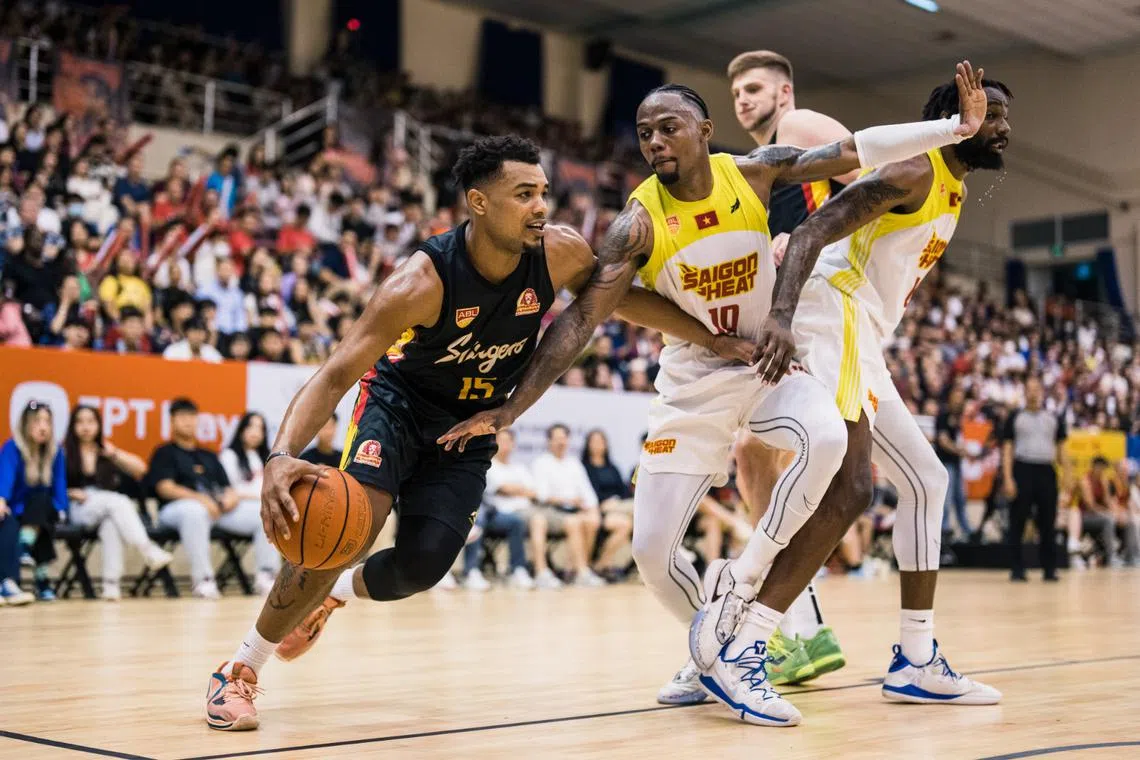 Singapore Slinger' Xavier Alexander driving to the basket against Saigon Heat's during Game 1 of the semi-finals on Monday.