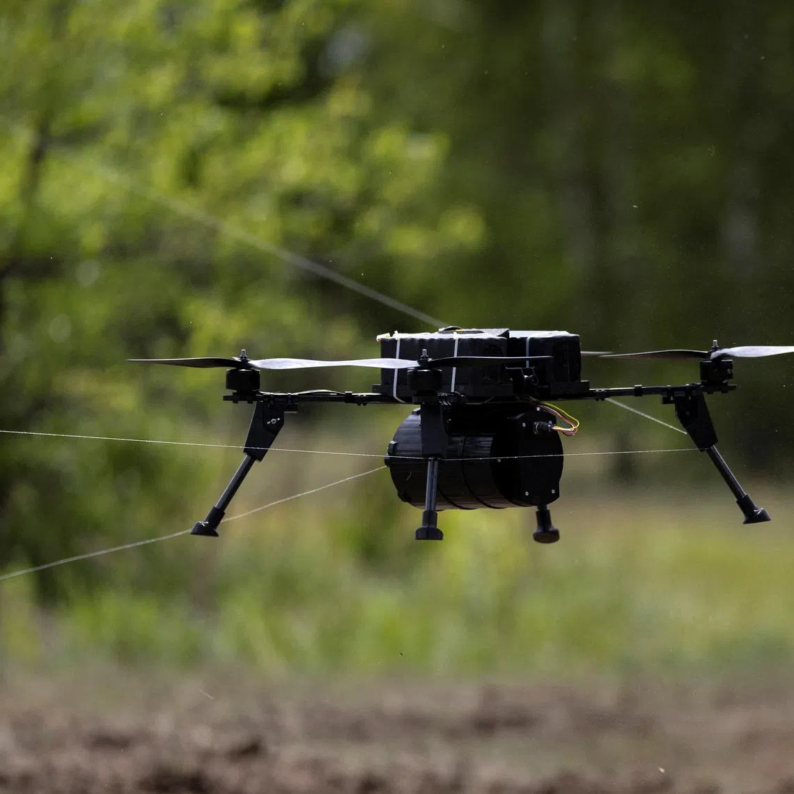 A drone that is controlled through a fiberoptic cable is snagged in its own cable during a demonstration at a defense technology event organized by the defence accelerator Defence Builder, amid Russia's attack on Ukraine, in an unspecified location in Ukraine, May 30, 2026. REUTERS/Thomas Peter