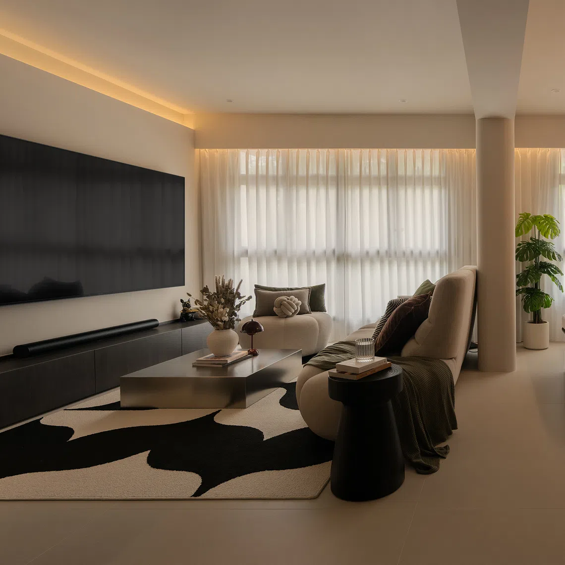 The open-plan layout of this four-room HDB flat was designed around the TV, allowing the home owners to see the screen from the sofa, dining table and kitchen island.