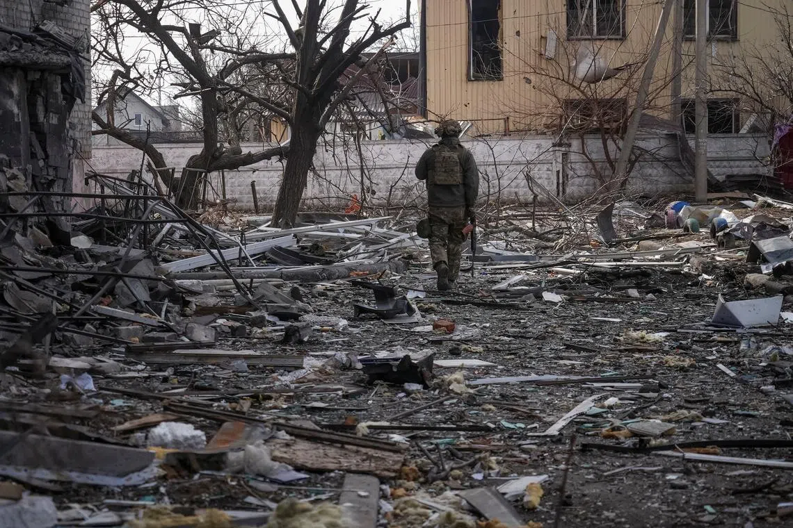 A Ukrainian serviceman passes by buildings damaged by Russian military strikes, amid Russia's attack on Ukraine, in the frontline town of Pokrovsk in Donetsk region, Ukraine March 6, 2025. REUTERS/Inna Varenytsia/File Photo