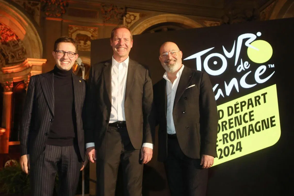 A handout photo made available by Florence's Municipality Press Office shows the official presentation of the 'Grand depart' 2024 held in Palazzo Vecchio, with Florence's Mayor Dario Nardella (left), the President of the Emilia Romagna region Stefano Bonaccini and the director of the Tour de France, Christian Prudhomme (centre).