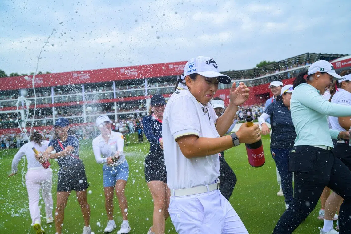 China’s Yin Ruoning being doused in champagne by her rivals after winning the LPGA Shanghai event on Oct 18.