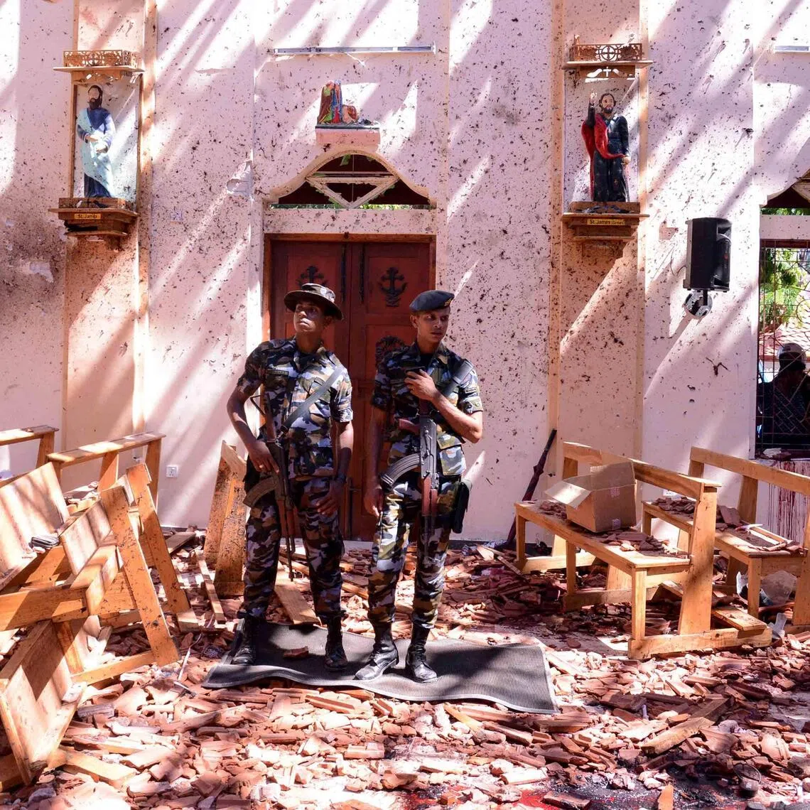 Sri Lankan soldiers inspect the St Sebastian’s Church at Katuwapitiya in Negombo on April 21, 2019, following a bomb blast during an Easter service.