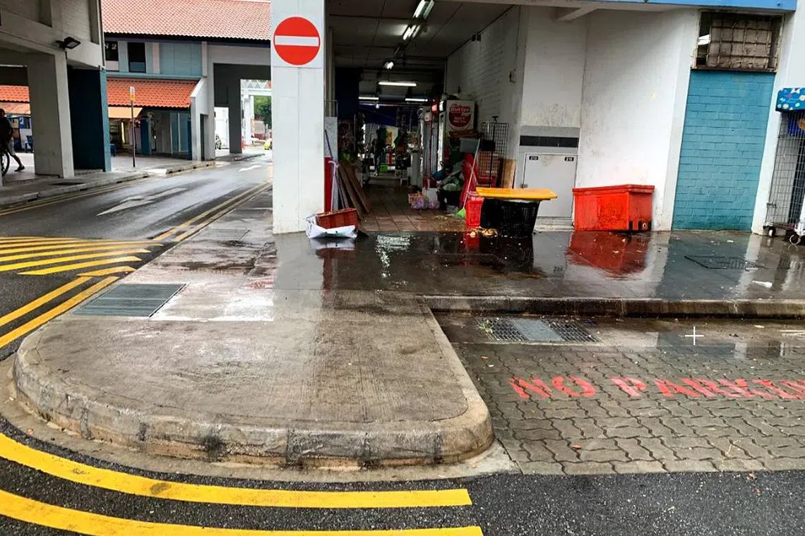 A refuse collection area near the coffee shop, where a man was seen falling to the ground during the scuffle in 2019.