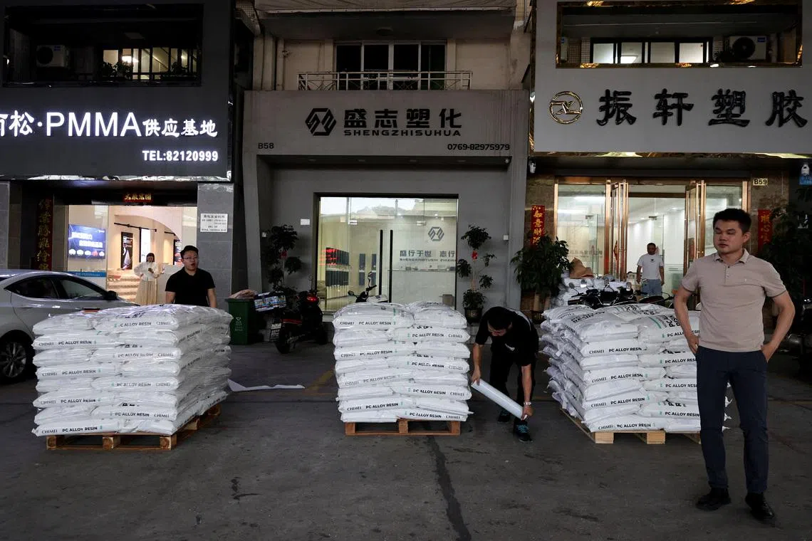 Workers prepare to ship bags of plastic pellets in Zhangmutou Town, also known as “Plastic City”, as rising oil prices drive up production costs for plastic manufacturers, in Dongguan, Guangdong province, China, April 1, 2026.  REUTERS/Go Nakamura