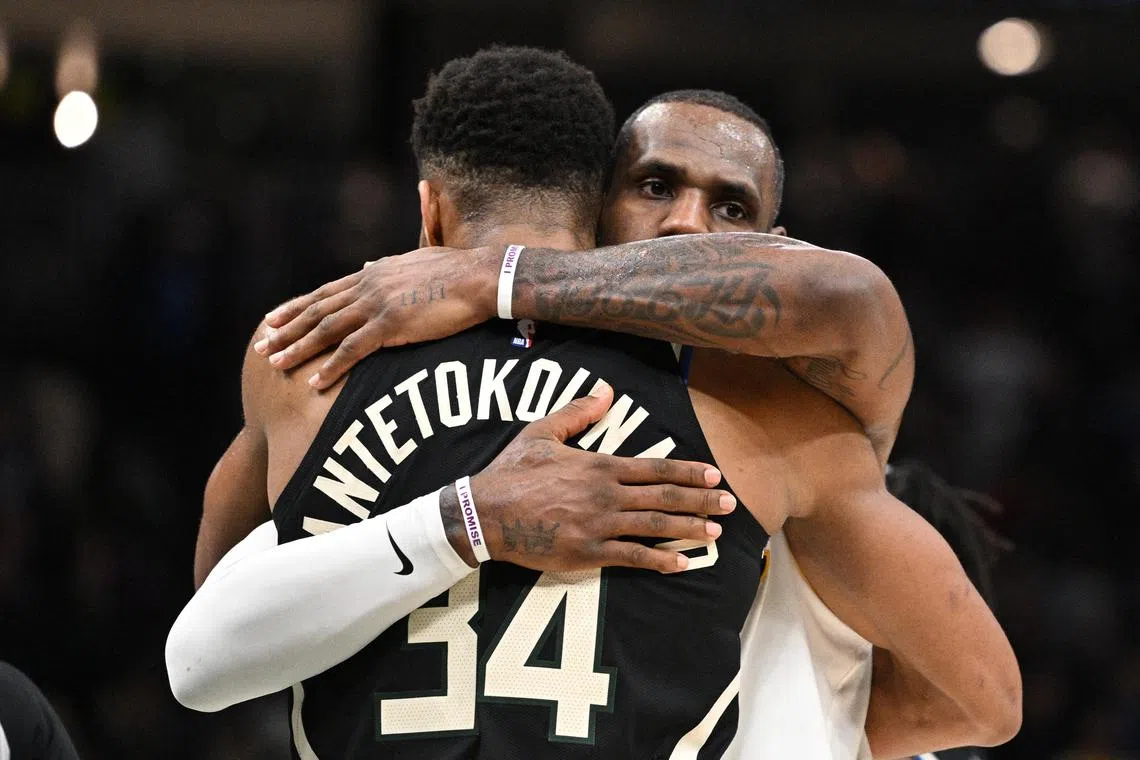 Lakers forward LeBron James (6) and Milwaukee Bucks forward Giannis Antetokounmpo (34) exchange hugs after the Los Angeles Lakers 133-129 win over the Milwaukee Bucks in December.