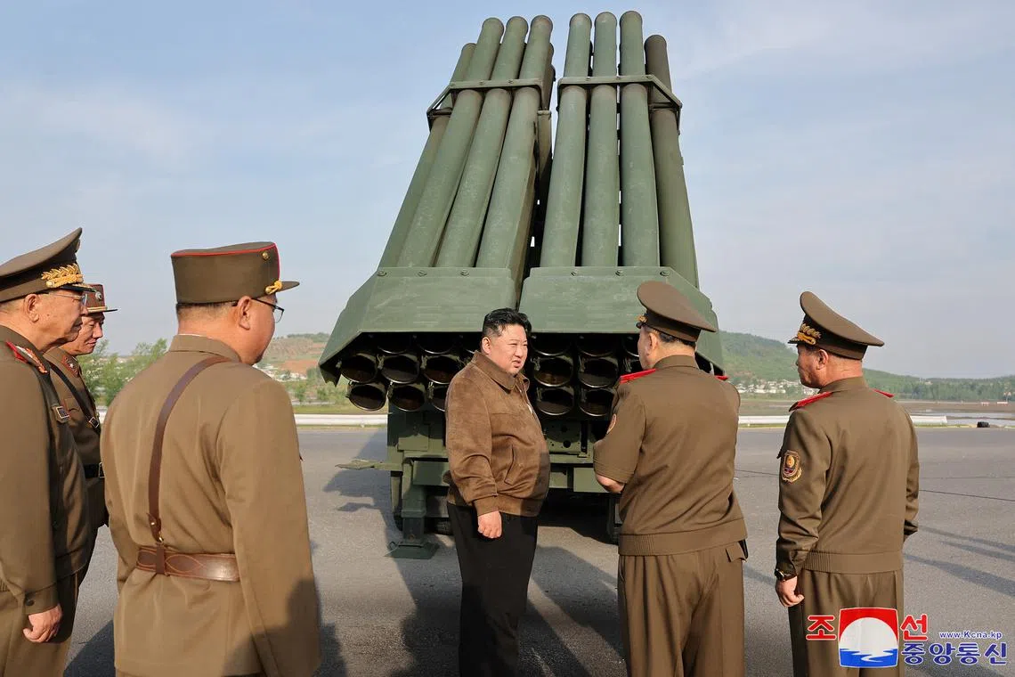 North Korean leader Kim Jong Un inspects the country's artillery weapon system and attends the test-firing of such weapons, on May 10.