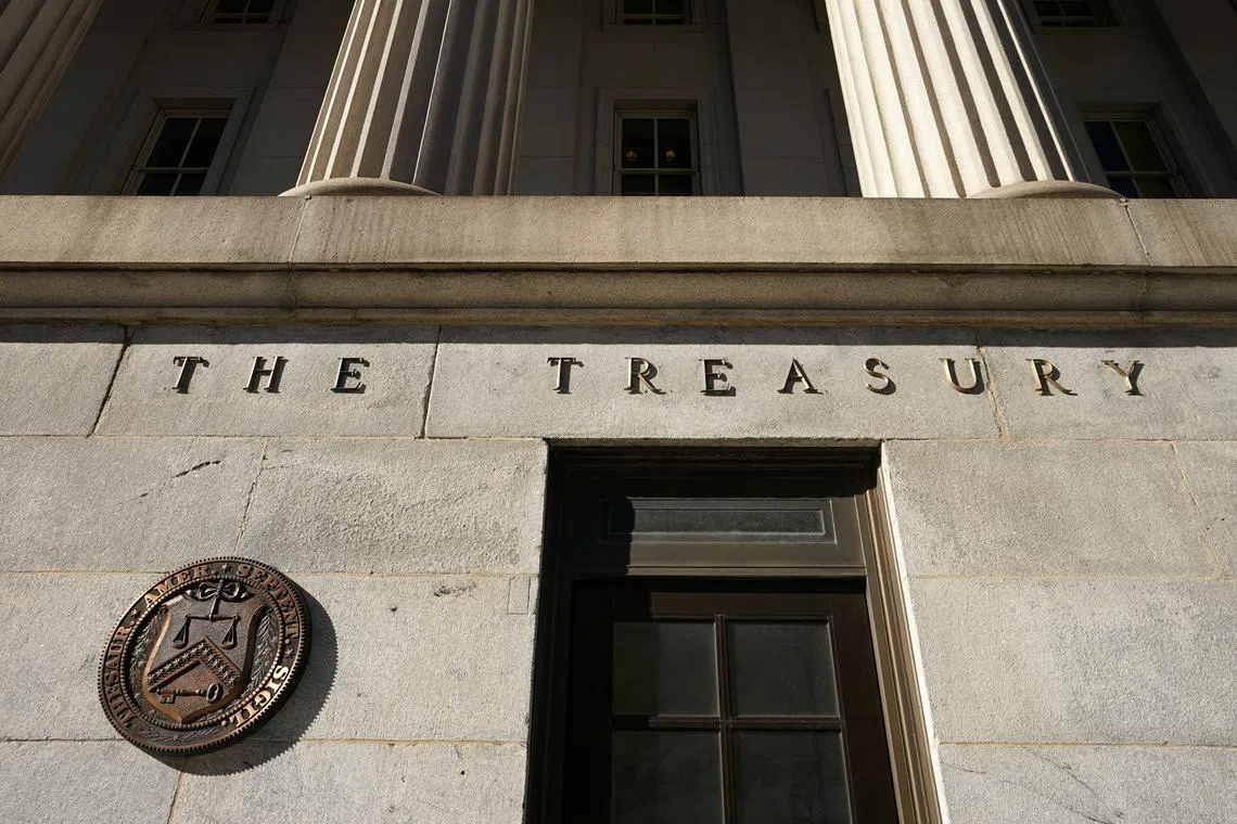 FILE PHOTO: A view shows a bronze seal beside a door at the U.S. Treasury building in Washington, U.S., January 20, 2023.  REUTERS/Kevin Lamarque