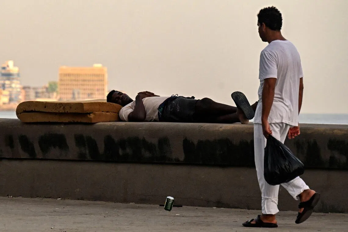 As the lights suddenly turned off across Havana late on Aug 2, residents sitting outside to get some respite from the summer heat audibly groaned.