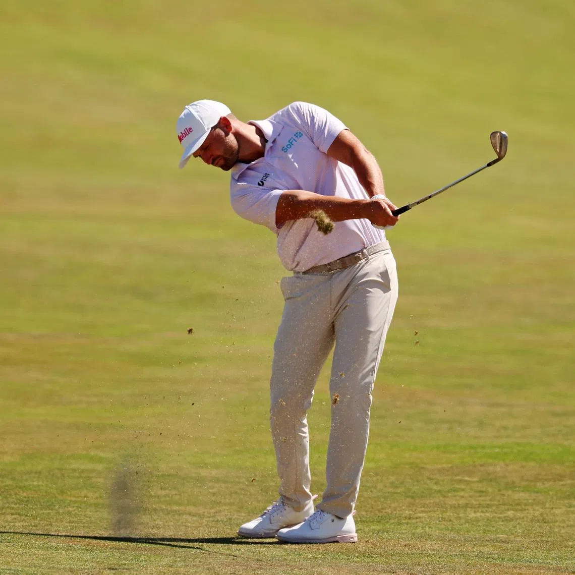Wyndham Clark makes his play on the third fairway during the final round of the U.S. Open golf tournament at Shinnecock Hills Golf Club.