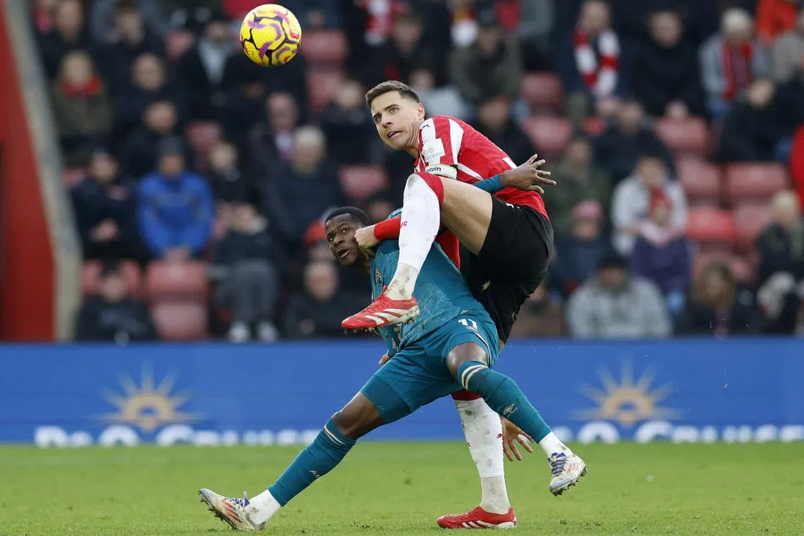 Soccer Football - Premier League - Southampton v AFC Bournemouth - St Mary's Stadium, Southampton, Britain - February 15, 2025 Southampton's Jan Bednarek in action with AFC Bournemouth's Dango Ouattara Action Images via Reuters/Peter Cziborra