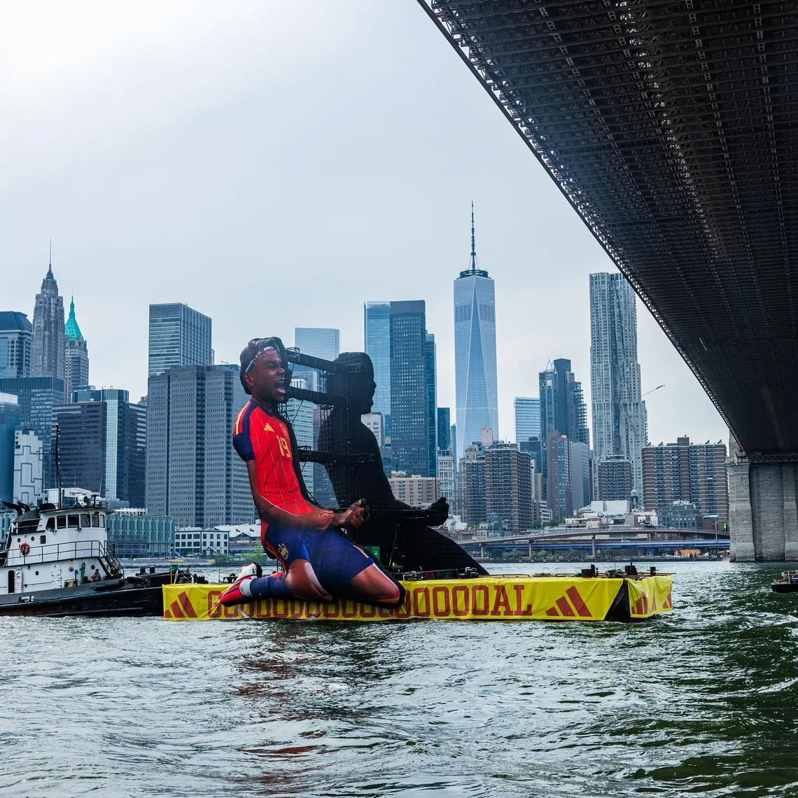 An Adidas barge, with an image of SpaniardLamine Yamal, floats on the East River on June 26.