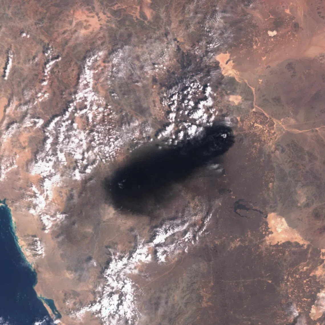 A satellite image showing black smoke rising in the vicinity of Saudi Arabia’s East-West oil pipeline on Sept 10.