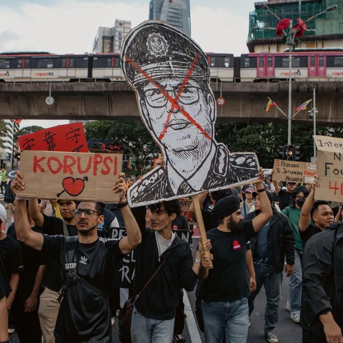 Protesters holding a cut-out of Malaysian Anti-Corruption Commission chief Azam Baki during a demonstration in Kuala Lumpur on Feb 15. 