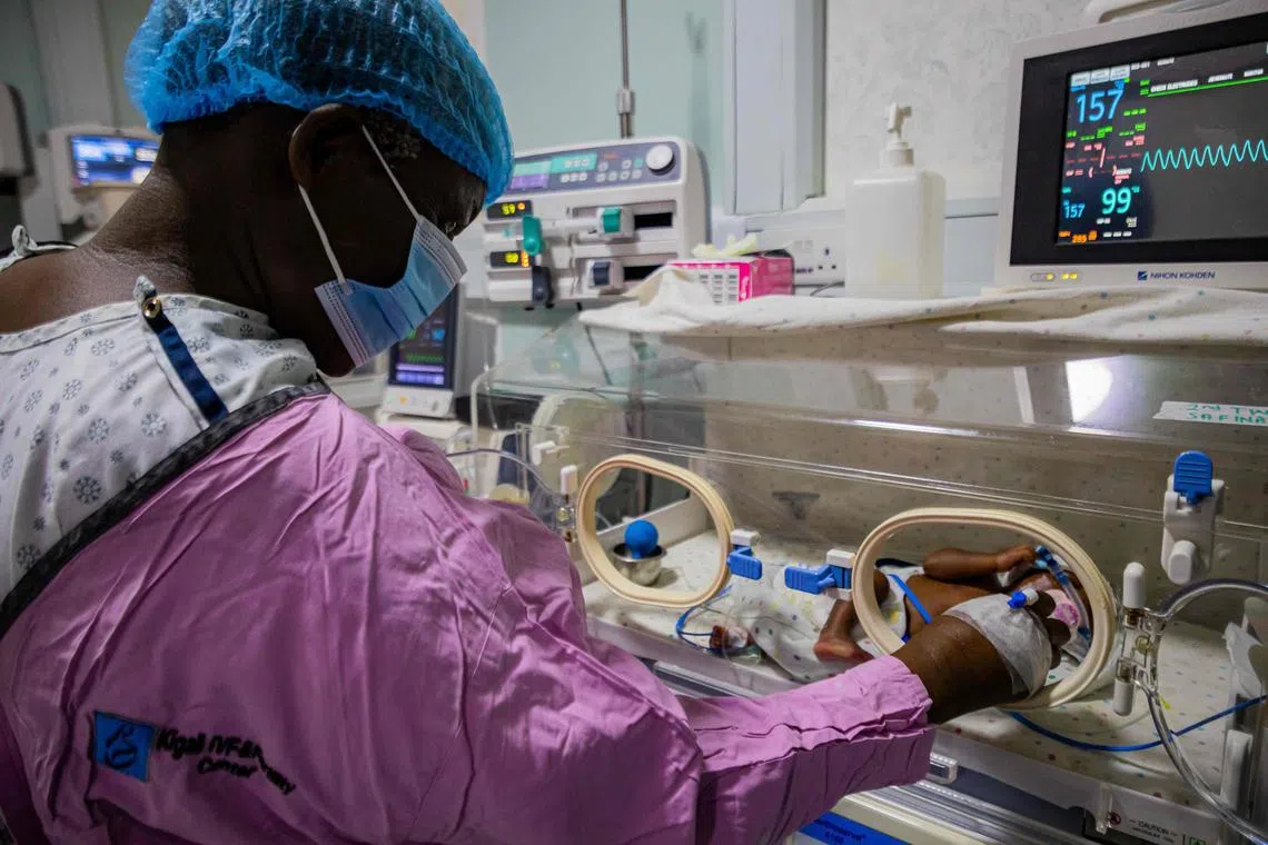 Ms Namukwaya,  checks on her twin babies inside an incubator at the Women's Hospital International and Fertility Centre.