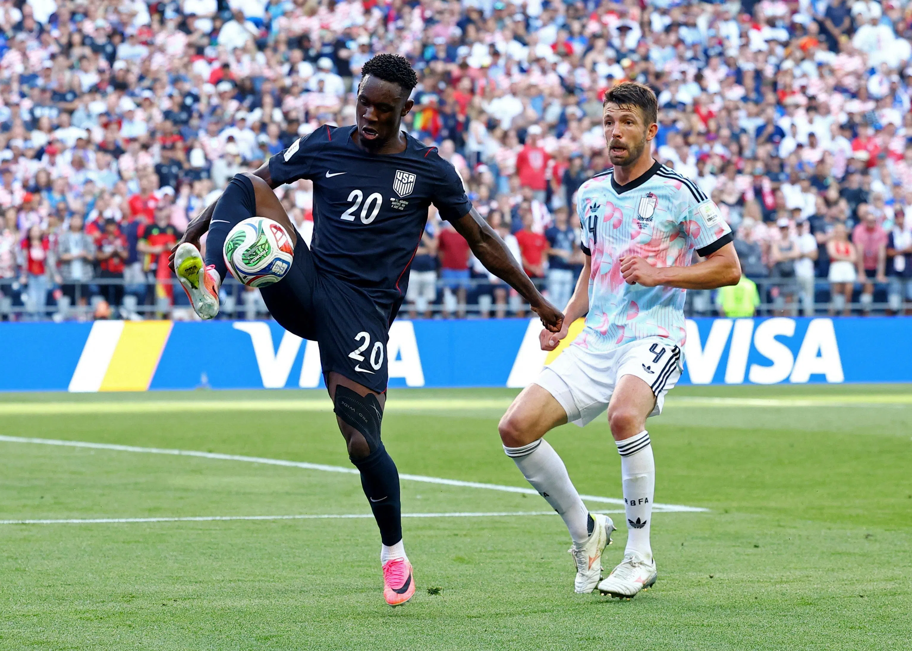 A reinstated Folarin Balogun of the US (left) in action against Belgium’s Brandon Mechele during their round-of-16 match on July 6 - which Belgium went on to win.