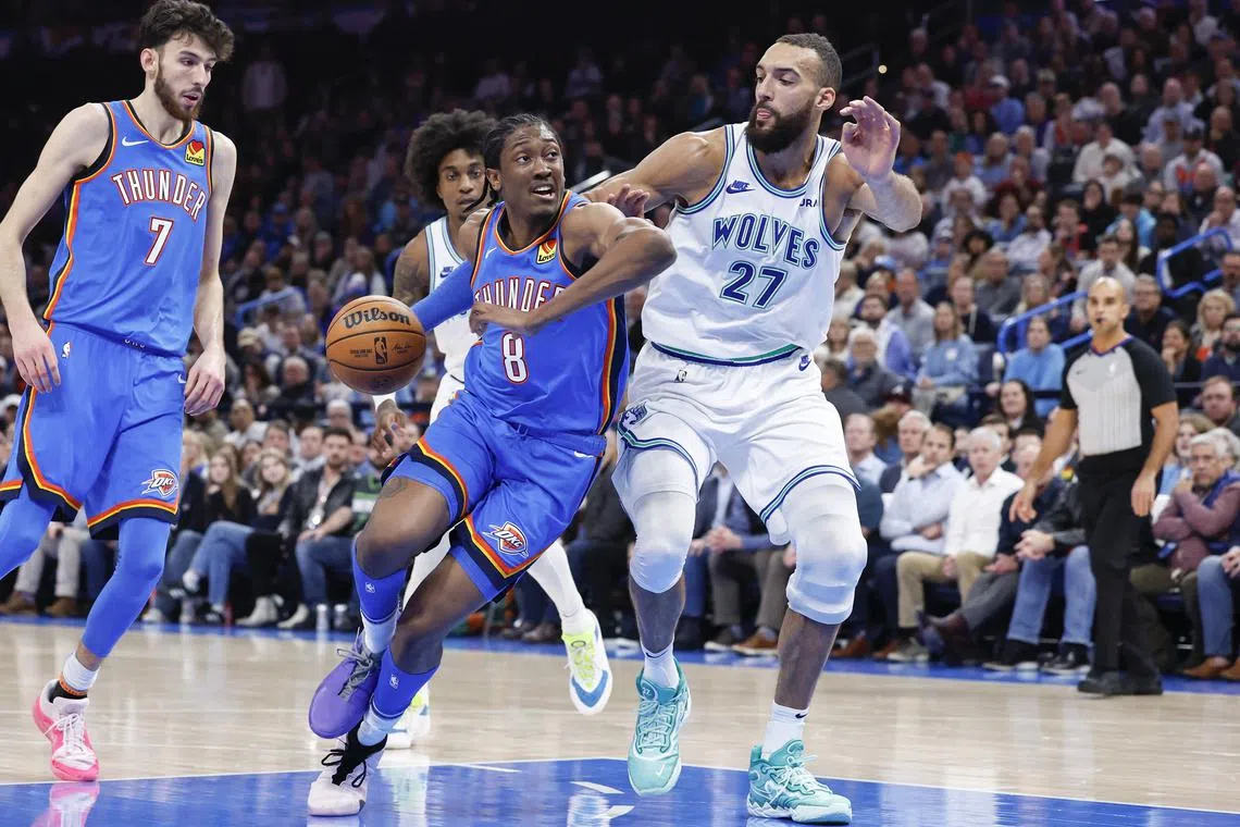 FILE PHOTO: Jan 29, 2024; Oklahoma City, Oklahoma, USA; Oklahoma City Thunder forward Jalen Williams (8) moves around Minnesota Timberwolves center Rudy Gobert (27) on a drive during the second half at Paycom Center. Mandatory Credit: Alonzo Adams-USA TODAY Sports/File Photo