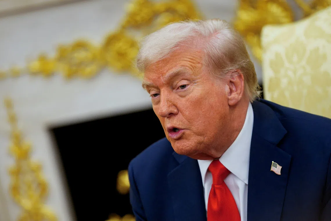 U.S. President Donald Trump participates in a bilateral meeting with Finland's President Alexander Stubb (not pictured), in the Oval office at the White House in Washington, D.C., U.S., October 9, 2025. REUTERS/Nathan Howard