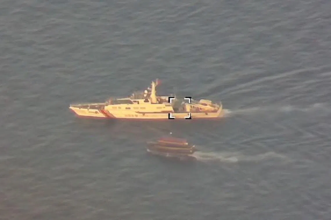 A Philippine flagged boat is blocked by a China Coast Guard vessel during an incident that resulted in a collision between the two vessels, in the disputed waters of the South China Sea in this screen grab obtained from handout video released October 22, 2023. China Coast Guard/Handout via REUTERS