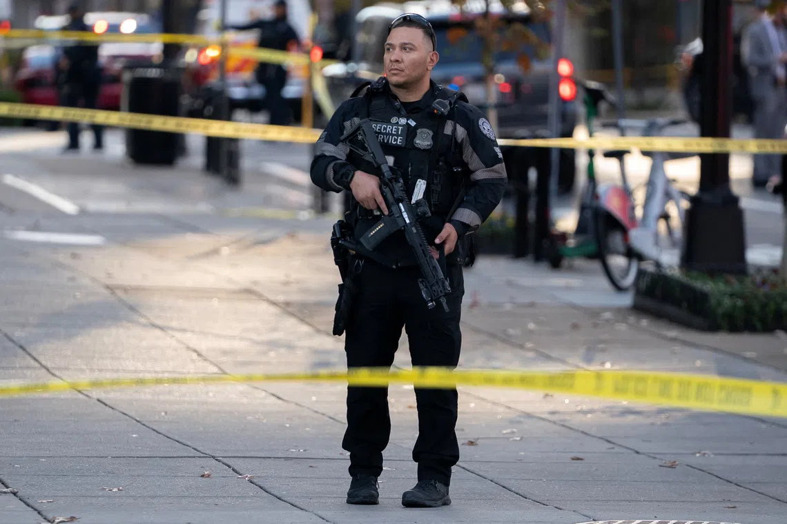 A member of the U.S. Secret Service stands guard in a cordoned-off area after two National Guard members were reportedly shot near the White House in Washington, D.C., U.S., November 26, 2025. REUTERS/Nathan Howard