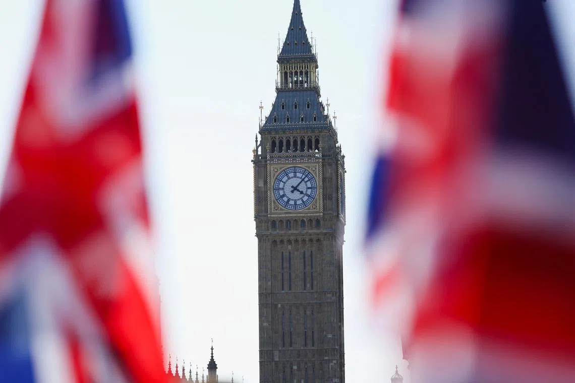 FILE PHOTO: Union Jack flags flutter in the wind near Big Ben at Parliament Square in London, Britain, August 27, 2024. REUTERS/Mina Kim/File Photo