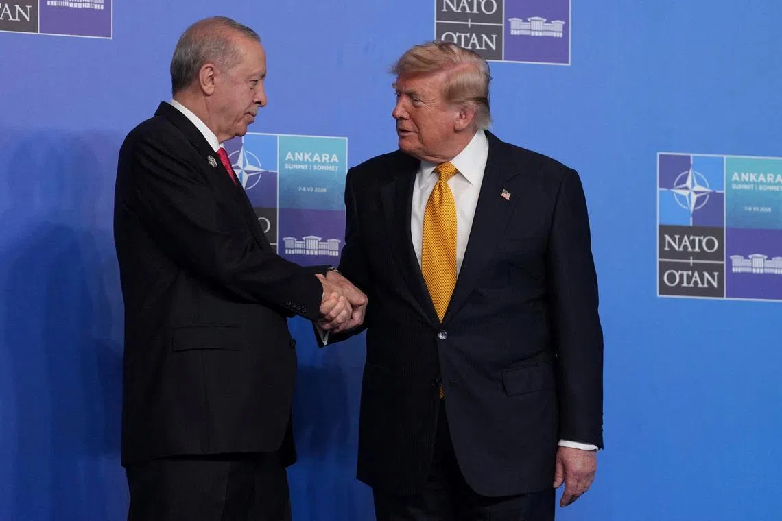 U.S. President Donald Trump, is greeted by Turkish President Recep Tayyip Erdogan as he arrives for the NATO summit in Ankara, Turkey, Wednesday, July 8, 2026.     Alastair Grant/Pool via REUTERS