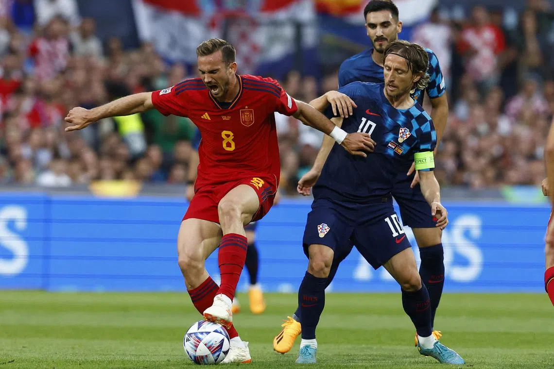 Croatia's Luka Modric in action with Spain's Fabian Ruiz in the Nations League final at Rotterdam.