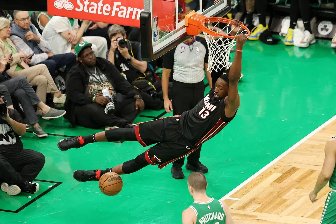 Bam Adebayo of the Miami Heat dunking the ball during the fourth quarter against the Boston Celtics in game seven of the Eastern Conference Finals at TD Garden in Boston, Massachusetts.