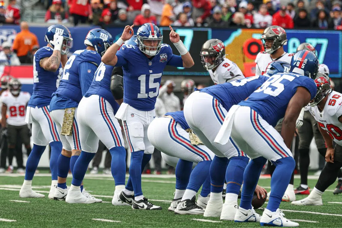 Nov 24, 2024; East Rutherford, New Jersey, USA; New York Giants quarterback Tommy DeVito (15) signals to teammates during the first half against the Tampa Bay Buccaneers at MetLife Stadium. Mandatory Credit: Vincent Carchietta-Imagn Images/ File Photo