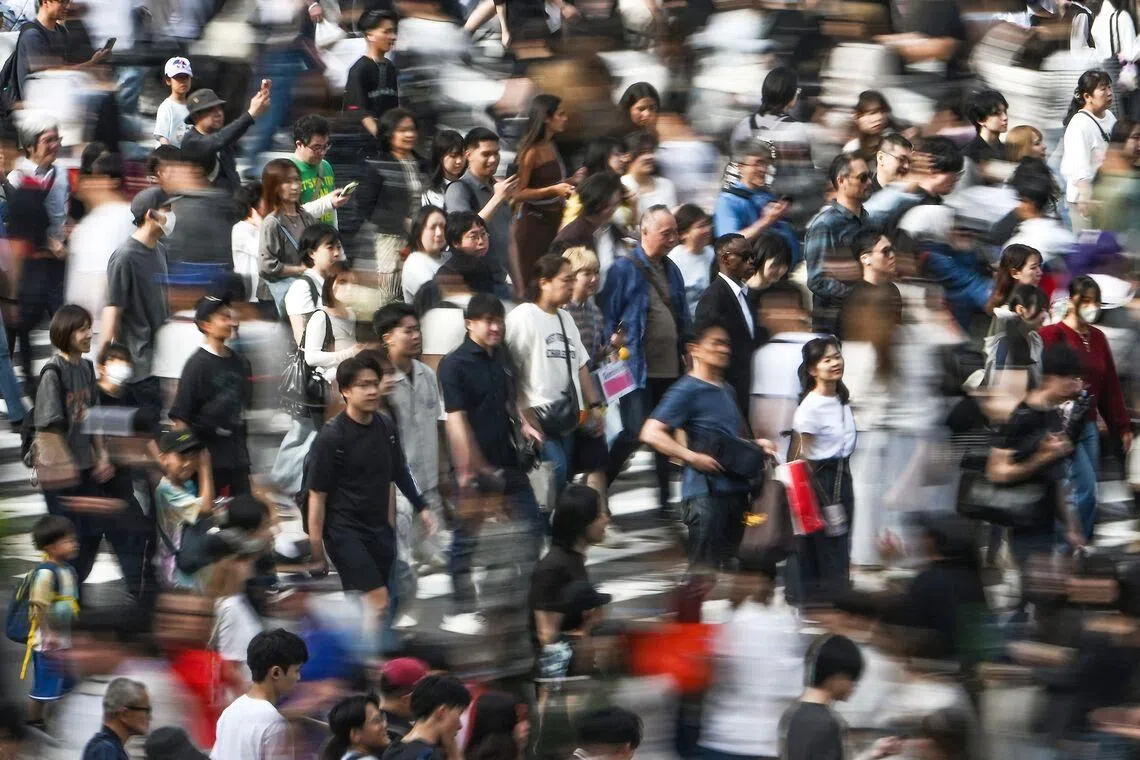 Japan’s Shibuya crossing, famous for its disciplined pedestrians, was the site of a viral video where a woman roughly slams into a child posing for a photo.