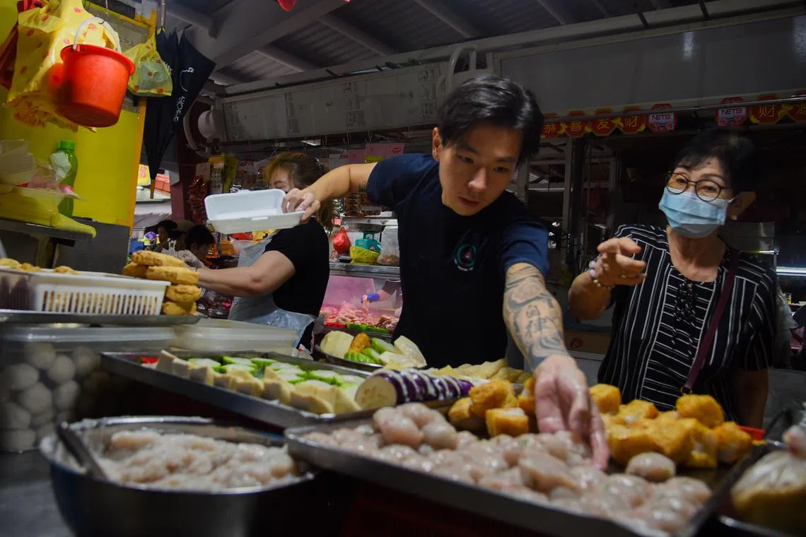 Mr Delonix Tan helps out at his family's fishball and yong tau foo stall at Toa Payoh every Sunday.