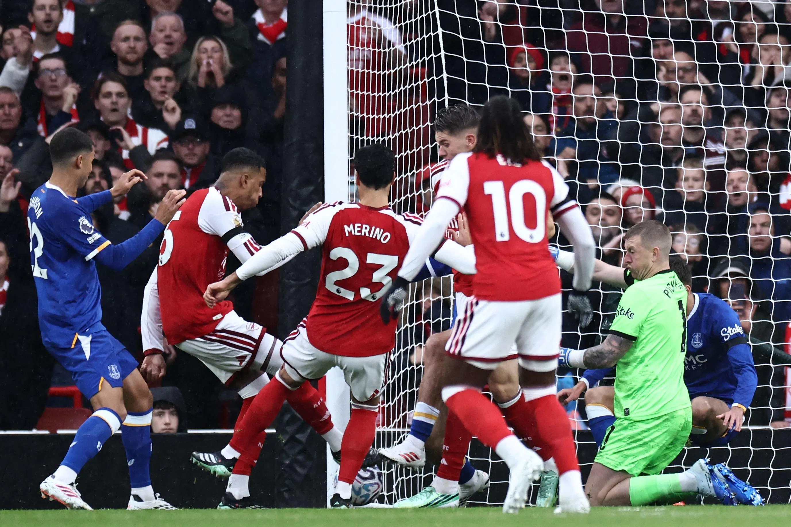Ezri Konsa (second from left) scores the opening goal of the match for Arsenal.
