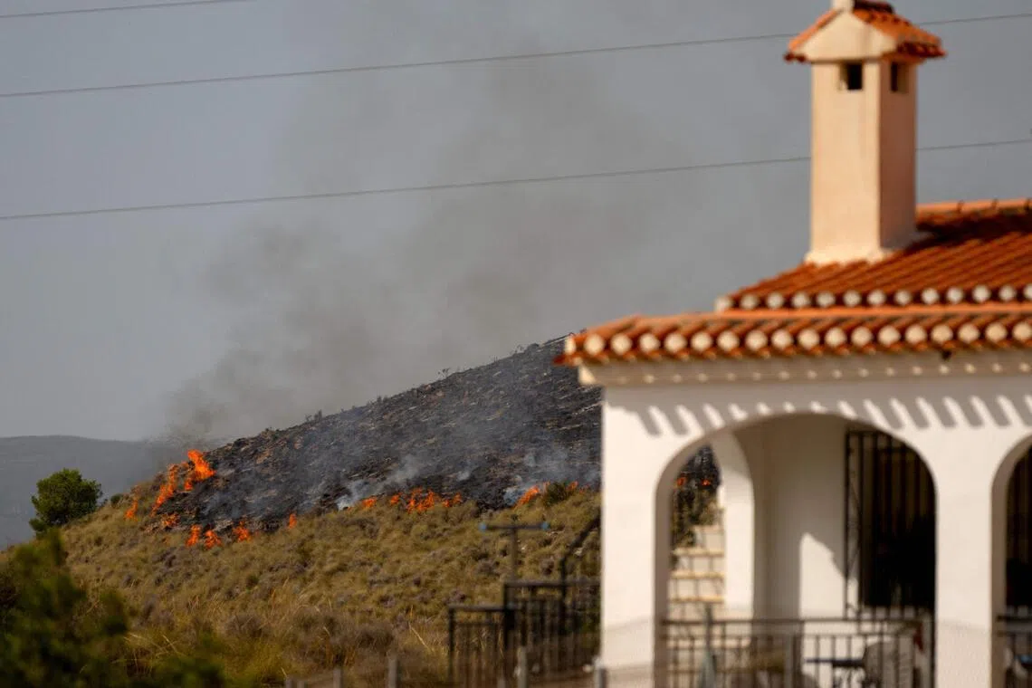 Charred vegetation and blackened homes are a grim reminder of the inferno that sent terrified people fleeing from their homes.