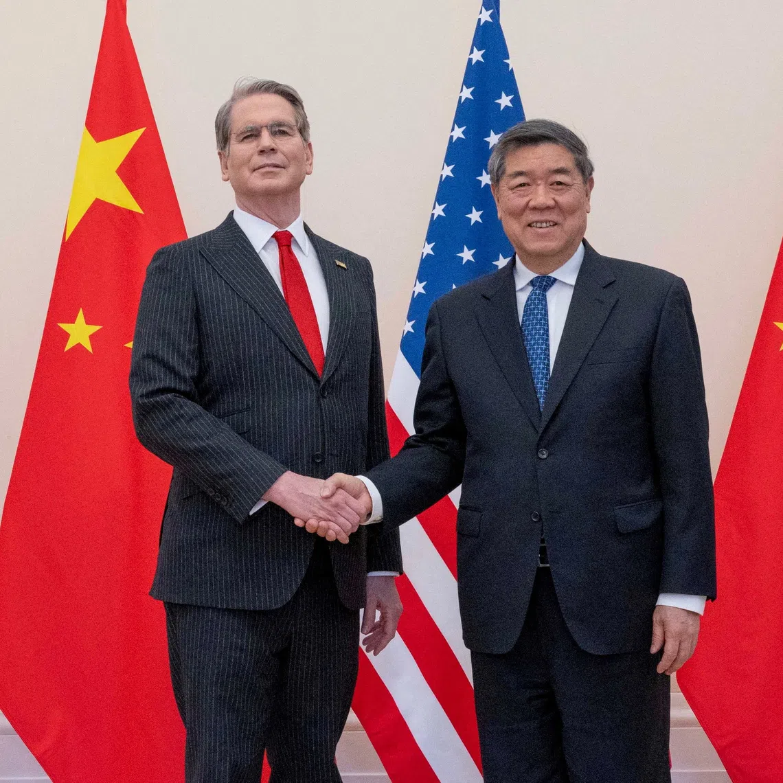 US Treasury Secretary Scott Bessent and Chinese Vice-Premier He Lifeng shake hands during trade talks at Organisation for Economic Co-operation and Development headquarters in Paris, France, on March 16.
