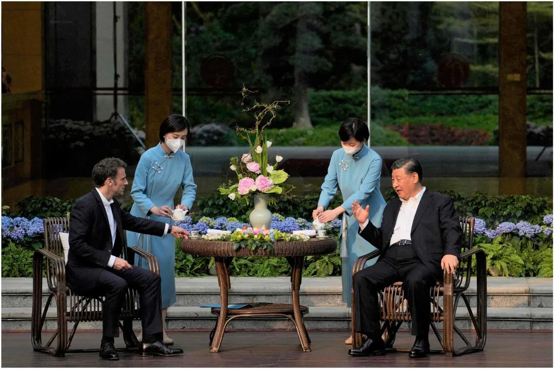 China President Xi Jinping (right) and his French counterpart Emmanuel Macron having tea at the Guandong governor's residence in Guangzhou on April 7.