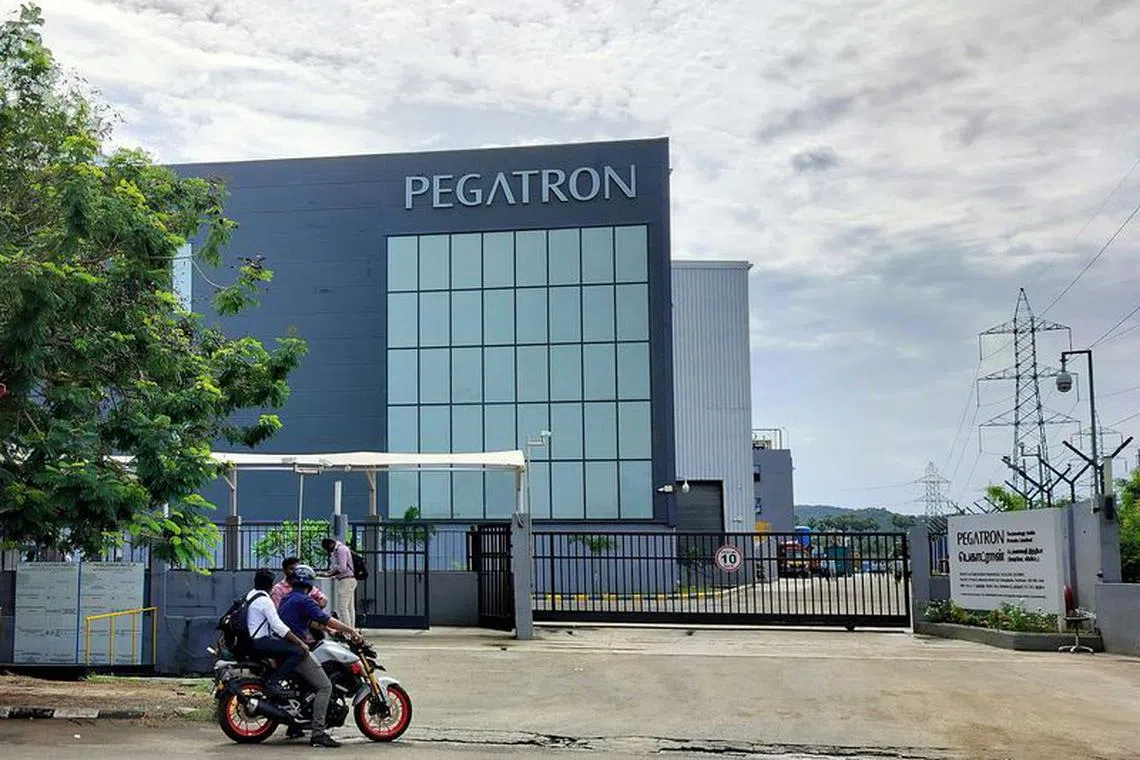 People are seen outside the main gate of the Pegatron facility following a fire incident at the facility near Chennai, India, September 26, 2023. REUTERS/Praveen Paramasivam