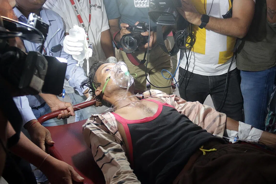 epa10093821 A patient in an ambulance as he is carried for a treatment after drinking poisonous liquor at a city hospital in Ahmedabad, Gujarat, India 26 July 2022 ( issued 27 July 2022). At least 40 people have died after consuming illegal alcohol in Gujarat's Botad district and 50 people were admitted to hospitals in Bhavnagar, Botad and Ahmedabad, according to police.  EPA-EFE/KRUTIKARAJ SOLANKI