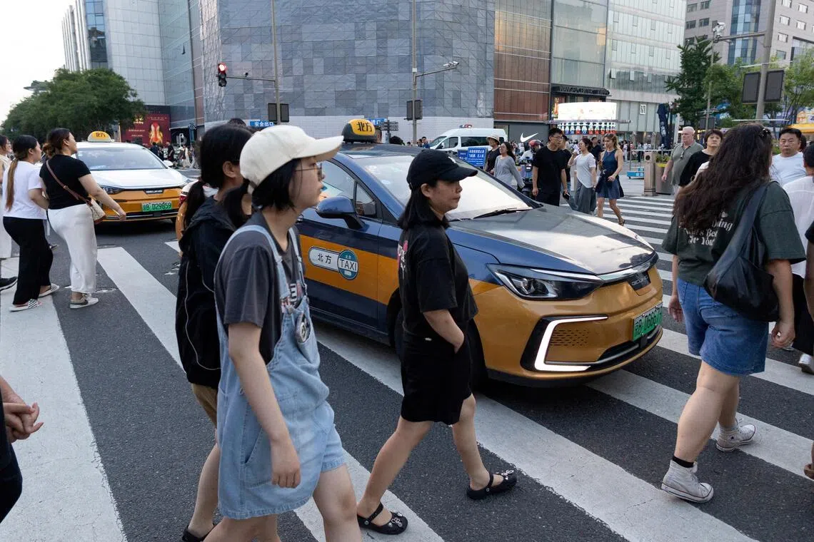 Economists say strengthening the social safety net is crucial for China to encourage household consumption in the long term.