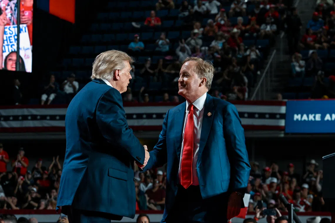 US President Donald Trump (left) is joined by Ken Paxton, the Texas attorney-general and Republican candidate for Senate, at a campaign rally on Oct 7 in San Antonio, Texas.