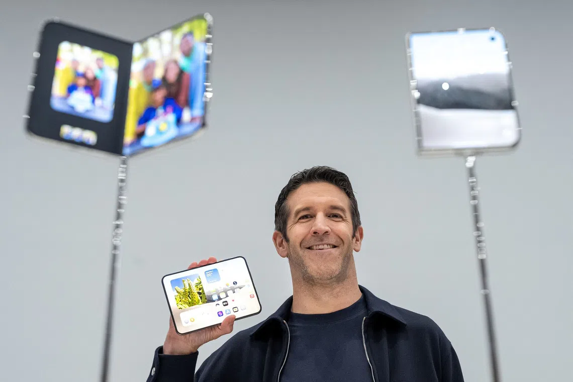 John Ternus, chief executive officer of Apple Inc., holds the iPhone Duo smartphone during a product unveiling event at Apple Park in Cupertino, California, US, on Wednesday, Sept. 9, 2026. Apple Inc. unveiled the company’s first foldable smartphone during a wide-ranging event Wednesday, betting that a new category can energize growth for its biggest-selling lineup. Photographer: David Paul Morris/Bloomberg