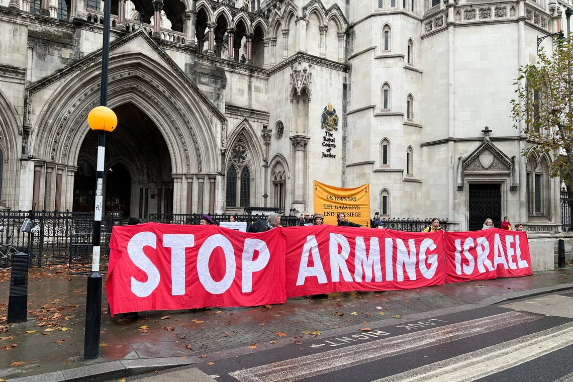Protesters demonstrate outside the Royal Courts of Justice ahead of a legal challenge brought by the Palestinian NGO Al-Haq over Britain's exports of parts for F-35 fighter jets to Israel, amid its conflict with Hamas, in London, Britain, November 18, 2024. REUTERS/Sam Tobin