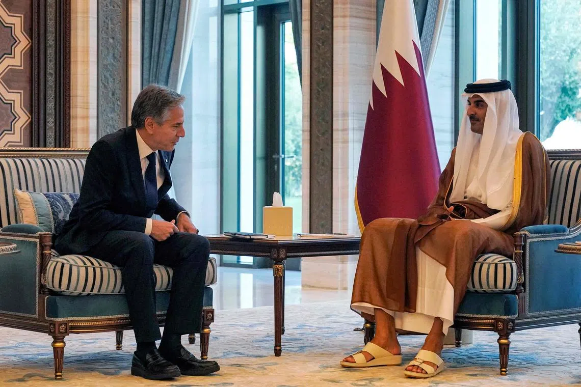 US Secretary of State Antony Blinken (left) meeting Qatar's Emir Sheikh Tamim bin Hamad al-Thani in Lusail on Oct 13.