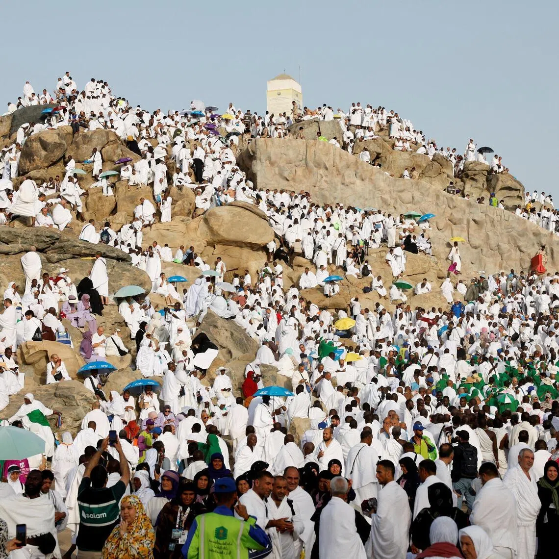 Muslim pilgrims gather at the Mount of Mercy on the plain of Arafat during the annual haj pilgrimage.
