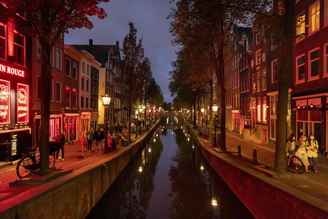 Amsterdam will ban cannabis smoking in the streets of the red light district from mid-May.