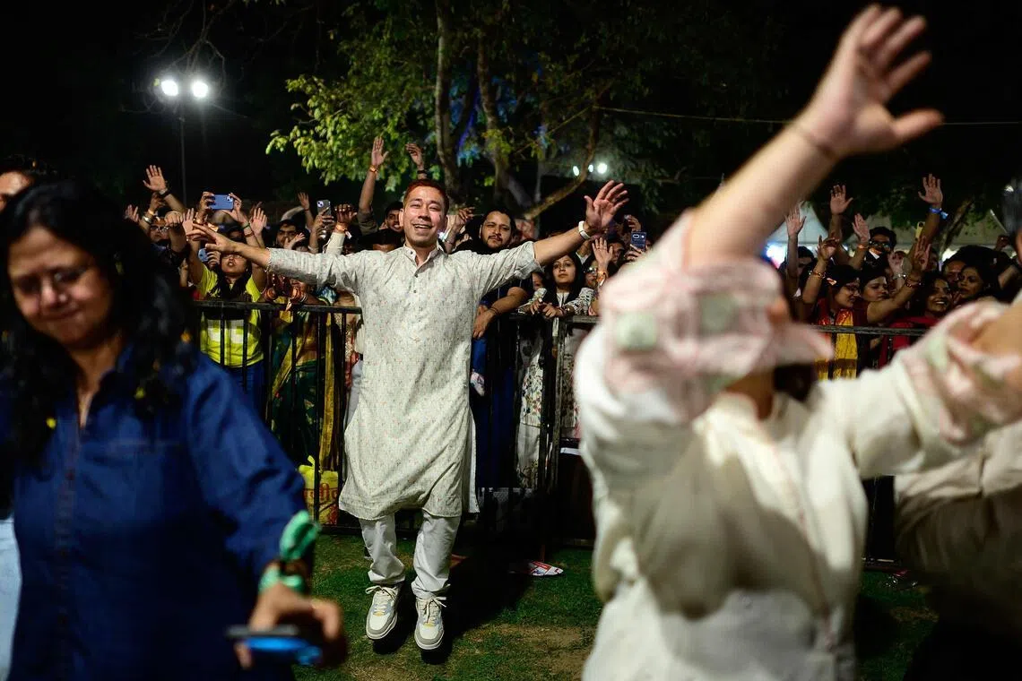 Revellers enjoy Hindu spiritual songs called Bhajans during the Sanatan Journey devotional music festival at the iconic Purana Qila in New Delhi on March 1, 2026.