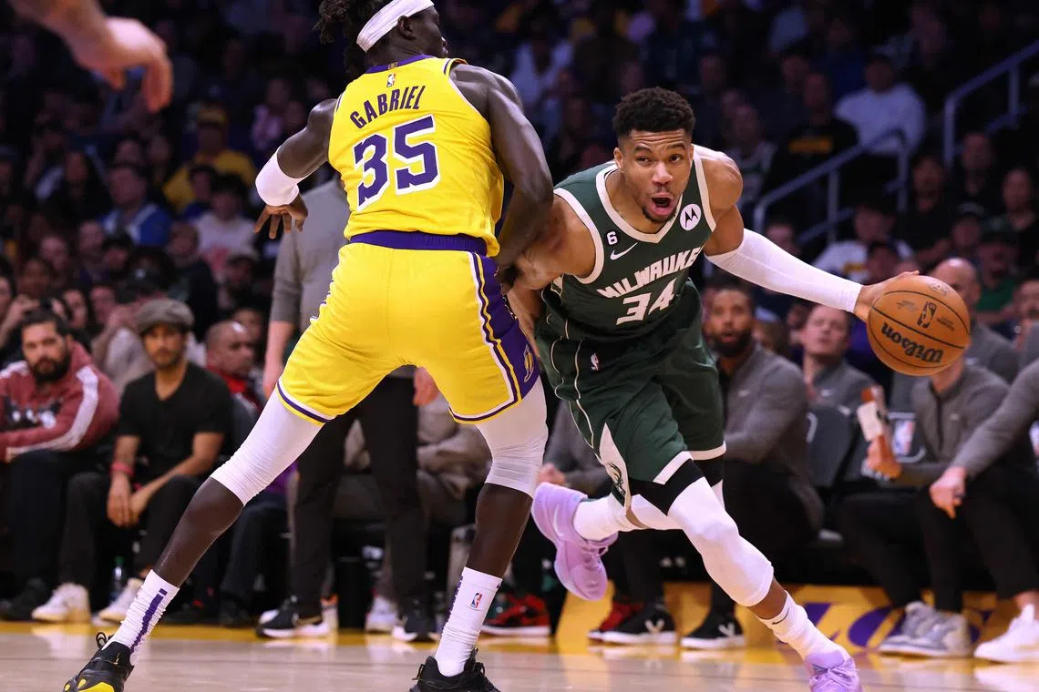 Giannis Antetokounmpo of the Milwaukee Bucks drives past Los Angeles' Wenyen Gabriel at Crypto.com Arena on Feb 9, 2023.