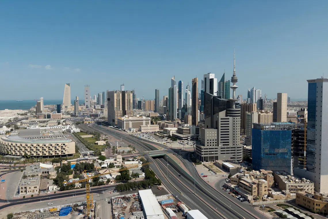 FILE PHOTO: A drone view shows Kuwait City, in the aftermath of strikes by Israel and the U.S. on Iran, in Kuwait, February 28, 2026. REUTERS/Stephanie McGehee/File Photo